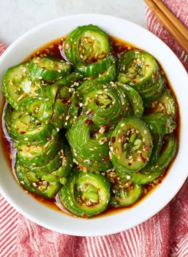 Bowl of fresh Asian cucumber salad with herbs and dressing