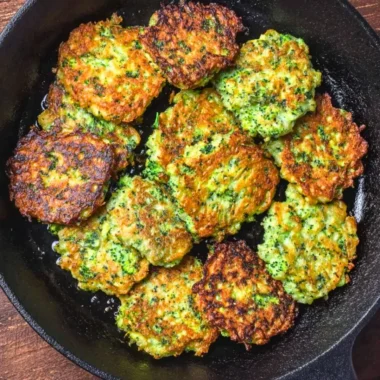 Plate of basic broccoli fritters garnished with herbs
