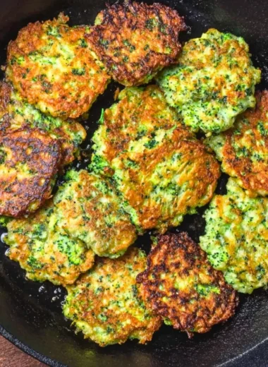 Plate of basic broccoli fritters garnished with herbs