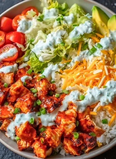 Delicious Buffalo Chicken Bowl with fresh vegetables and sauces