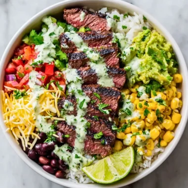 Cilantro lime steak bowl garnished with fresh cilantro and lime wedges