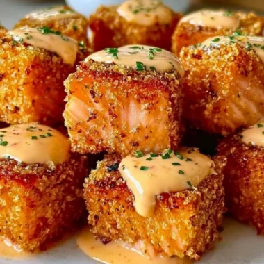 Crispy Bang Bang Salmon Bites served on a plate with dipping sauce
