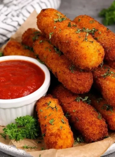Plate of homemade mozzarella sticks ready to be served.