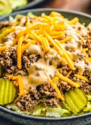 Keto Big Mac Salad with lettuce, burger patties, cheese, and special sauce