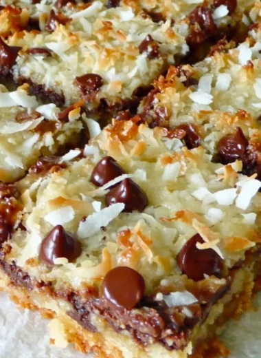 Delicious Magic Cookie Bars topped with chocolate and nuts