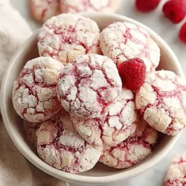 Plate of homemade raspberry sugar cookies with fresh raspberries