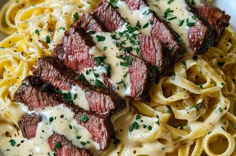 Savory steak gorgonzola alfredo with creamy parmesan sauce served on a plate