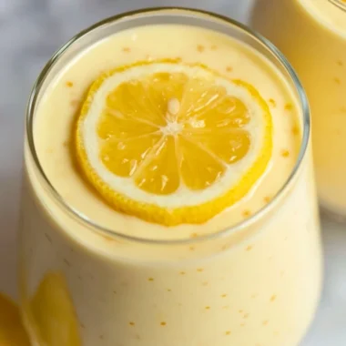 Delicious lemon cream chia pudding served in a glass with fresh lemon garnish.