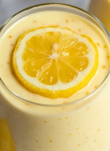 Delicious lemon cream chia pudding served in a glass with fresh lemon garnish.