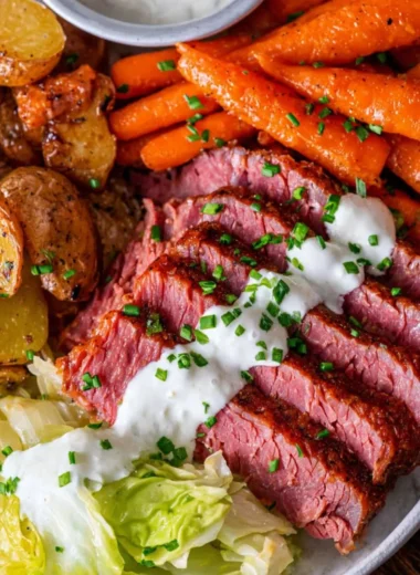 Delicious corned beef and cabbage served on a plate with carrots
