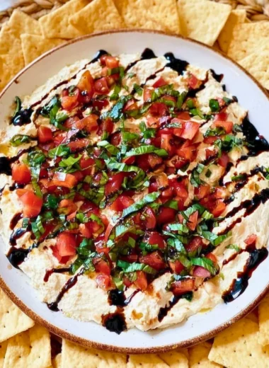 Delicious bruschetta dip served in a bowl with fresh ingredients