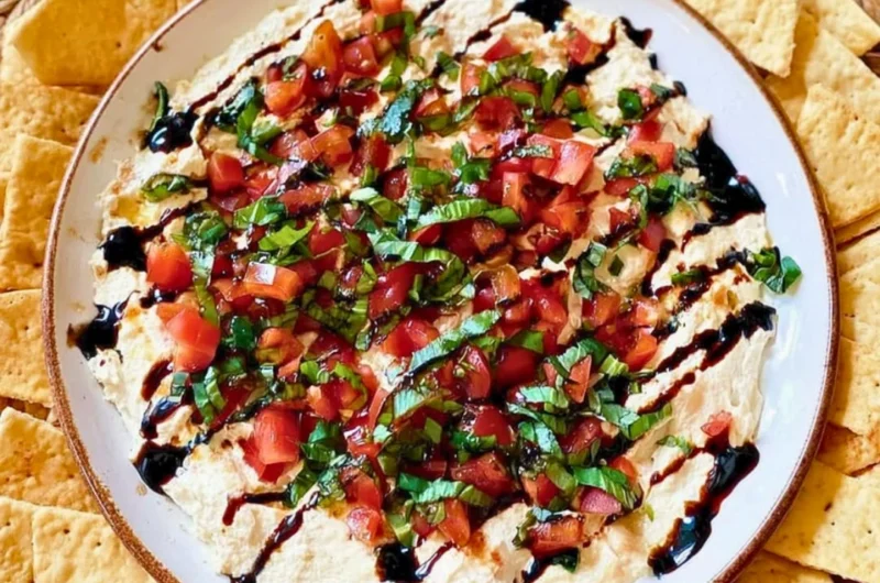 Delicious bruschetta dip served in a bowl with fresh ingredients