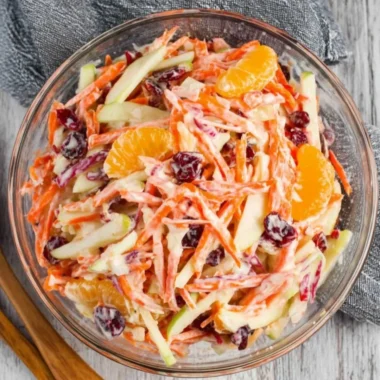 Fresh Carrot Apple Salad with vibrant colors and healthy ingredients.