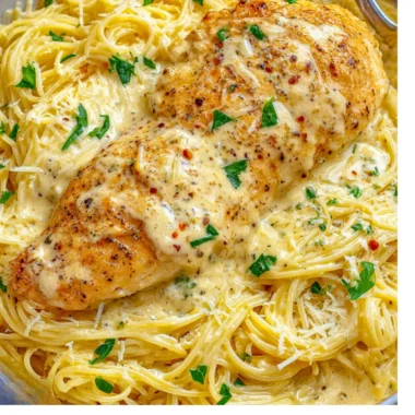 Crock Pot Angel Chicken served with a side of vegetables and rice