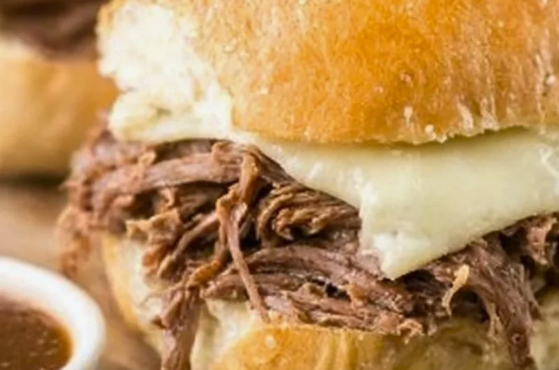 Delicious Crock Pot French Dip sandwich with tender beef and au jus