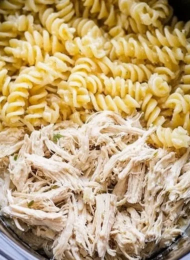 Delicious Garlic Parmesan Chicken Pasta served with herbs and cheese