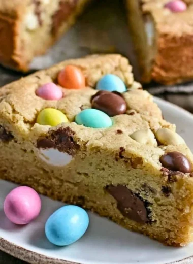 Delicious Giant Candy Cookie Pie featuring colorful candies and cookie crust.