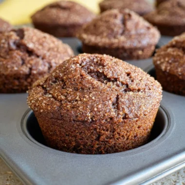 Delicious glazed gingerbread muffins on a festive table