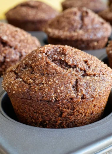 Delicious glazed gingerbread muffins on a festive table