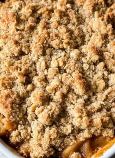 Delicious gluten-free apple crisp topped with oats and cinnamon