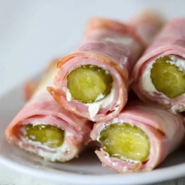 Ham and Pickle Roll-ups with Cream Cheese on a serving platter