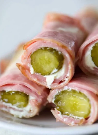 Ham and Pickle Roll-ups with Cream Cheese on a serving platter
