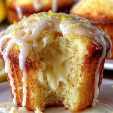 Freshly baked lemon cream cheese muffins on a plate