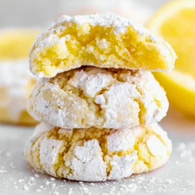 Freshly baked Lemon Crinkle Cookies with a dusting of powdered sugar