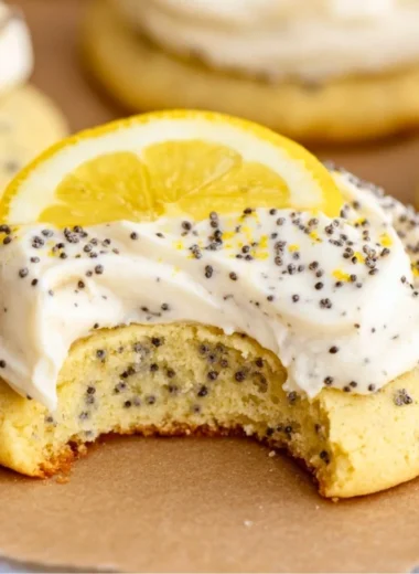 Lemon poppy seed cookies topped with creamy cheesecake frosting