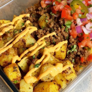 Delicious Loaded Potato Taco Bowl with crispy potatoes and fresh toppings