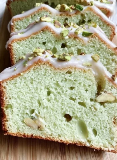 Delicious slice of Pistachio Pudding Bread with nuts on top