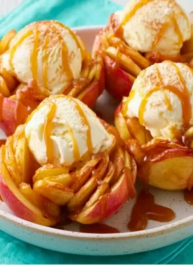 Delicious slow cooker bloomin' baked apples topped with cinnamon and nuts