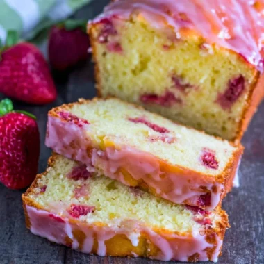 Delicious homemade Strawberry Pound Cake with fresh strawberries and a golden crust.