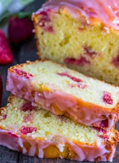 Delicious homemade Strawberry Pound Cake with fresh strawberries and a golden crust.