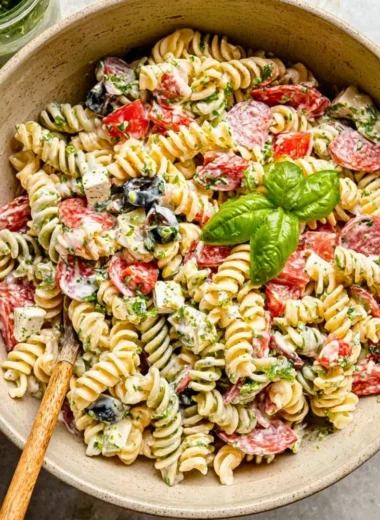 Creamy Italian pasta salad served in a bowl with fresh vegetables