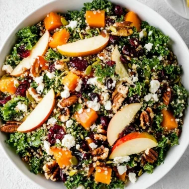 A colorful and healthy fall salad made with seasonal vegetables and fruits.