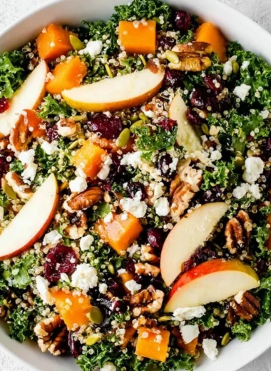 A colorful and healthy fall salad made with seasonal vegetables and fruits.