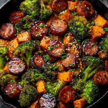 Honey garlic sausage with sweet potatoes on a sheet pan for a flavorful dinner