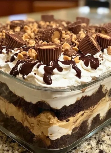 No-bake peanut butter chocolate mousse pie topped with whipped cream and chocolate shavings