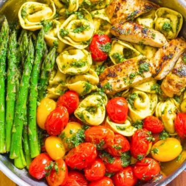 One-Pan Pesto Chicken with tortellini and mixed veggies for a healthy dinner