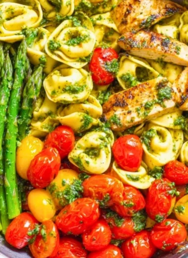 One-Pan Pesto Chicken with tortellini and mixed veggies for a healthy dinner