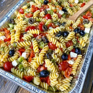 Tri Colored Rotini Pasta Salad with fresh vegetables and dressing