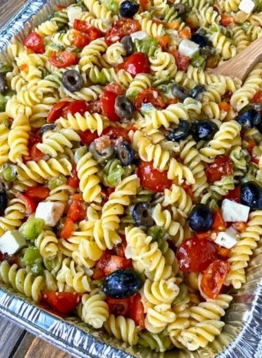 Tri Colored Rotini Pasta Salad with fresh vegetables and dressing