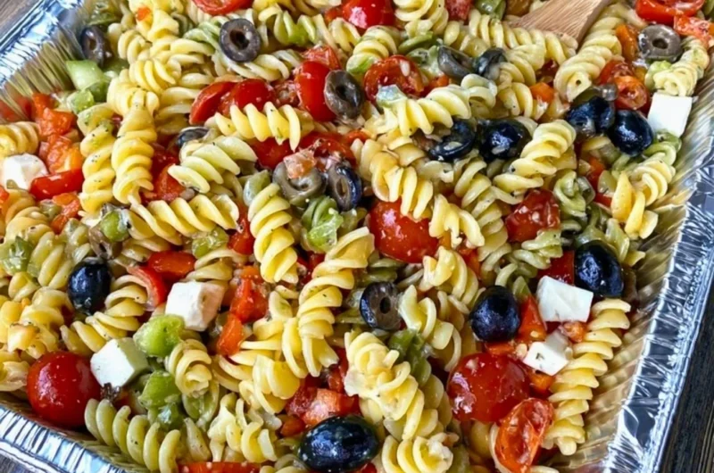 Tri Colored Rotini Pasta Salad with fresh vegetables and dressing