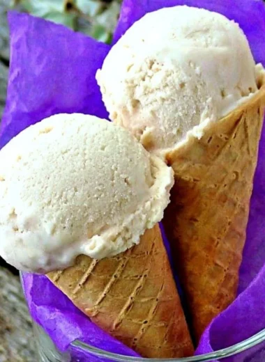Delicious banana frozen yogurt topped with fresh banana slices and nuts