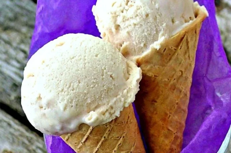 Delicious banana frozen yogurt topped with fresh banana slices and nuts
