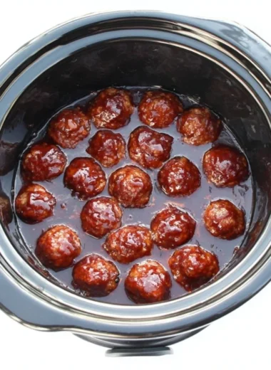 A plate of tender BBQ meatballs glazed with rich barbecue sauce