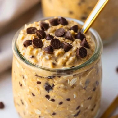 Delicious cookie dough overnight oats topped with chocolate chips and nuts