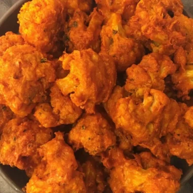 Crispy baked buffalo cauliflower wings served with dipping sauce