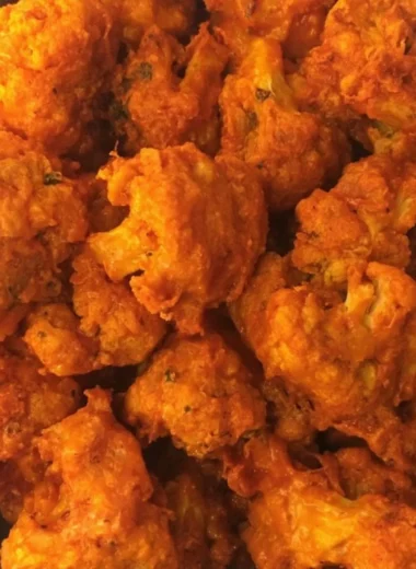Crispy baked buffalo cauliflower wings served with dipping sauce